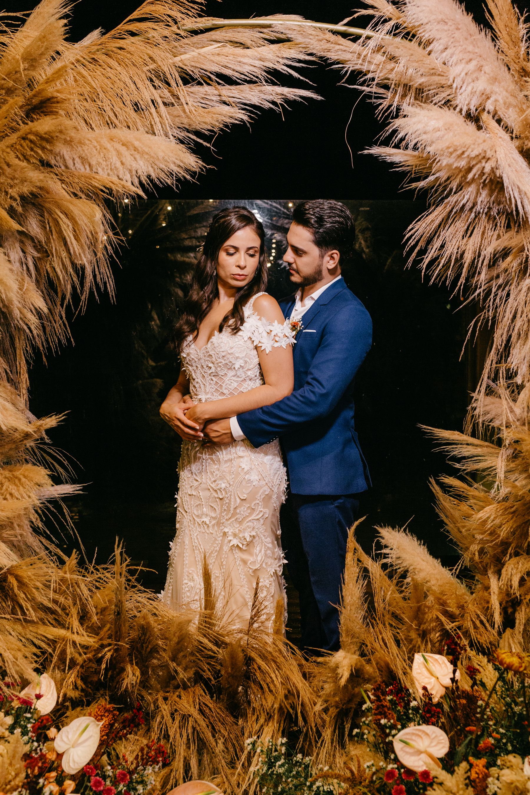 A wedding couple sharing their first dance while guests take photos